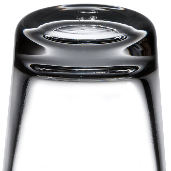 A close up of 48 Libbey shot glasses on a table.