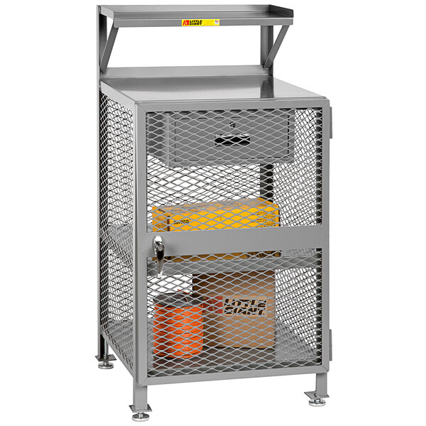 A white metal Little Giant shop desk with a drawer and shelves.