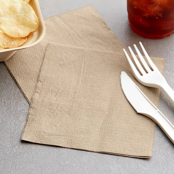 A fork and knife next to a Natural Kraft EcoChoice luncheon napkin.