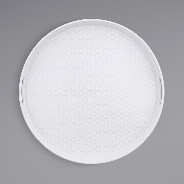 A white round melamine tray with a pattern on the surface.