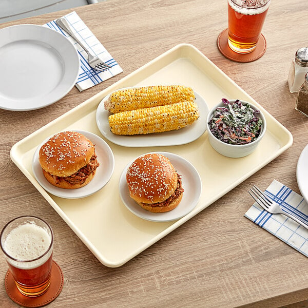 A Baker's Mark ivory non-stick tray with corn on it.