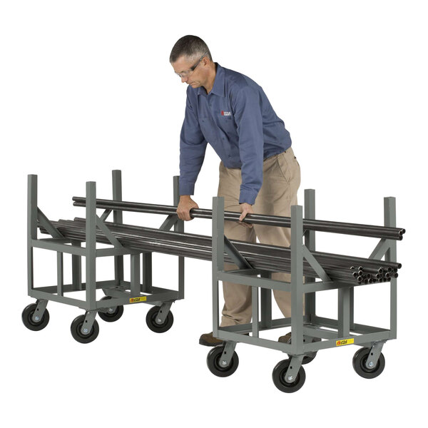 A metal ergonomic bar cradle truck with four wheels, designed for transporting long bars or pipes.