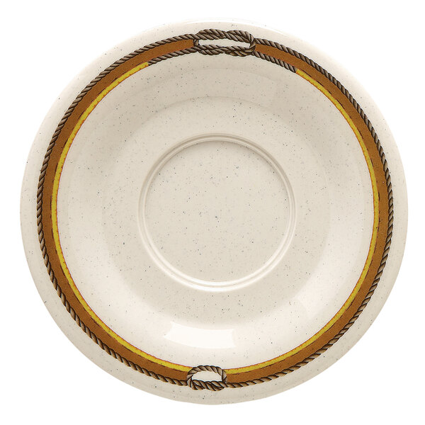 A white saucer with a brown border and yellow design.