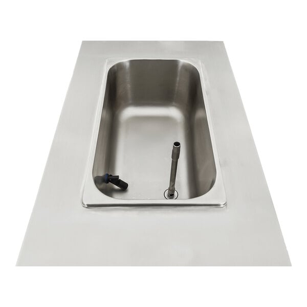 A stainless steel Spaceman single bowl slushy machine with a drain.