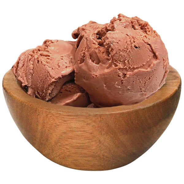 A bowl of G.S. Gelato Nutella gelato with a scoop on a table.