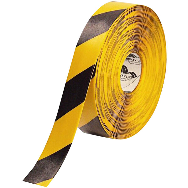 A roll of Mighty Line yellow tape with black chevrons and stripes.