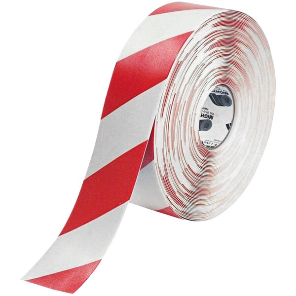 A roll of Mighty Line white tape with red chevrons and red and white stripes.