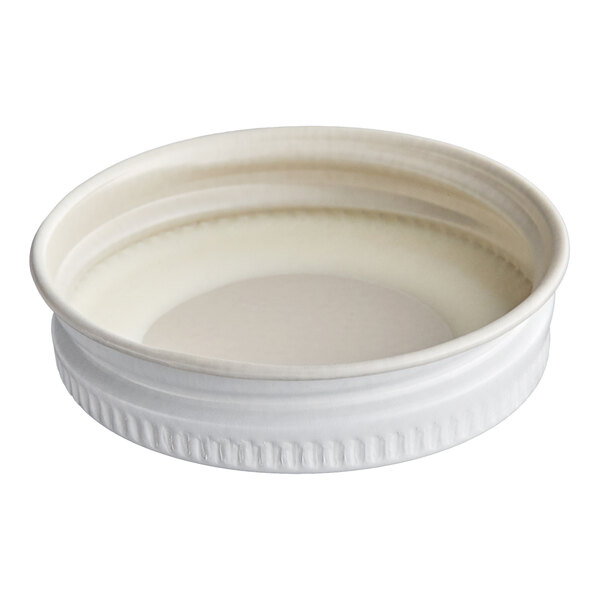 A white metal lid with a plastisol liner designed for sealing containers.