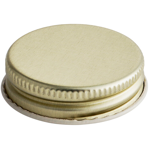 A close-up of a 38/400 gold metal lid with plastisol liner.