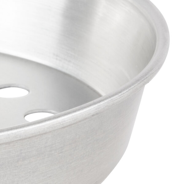 An American Metalcraft tin-plated steel deep dish pizza pan with holes in it.