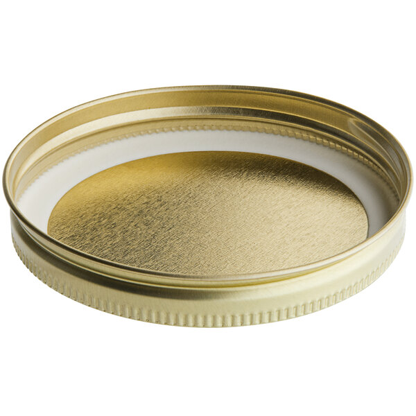 A 89/400 gold metal lid with a white plastisol liner.
