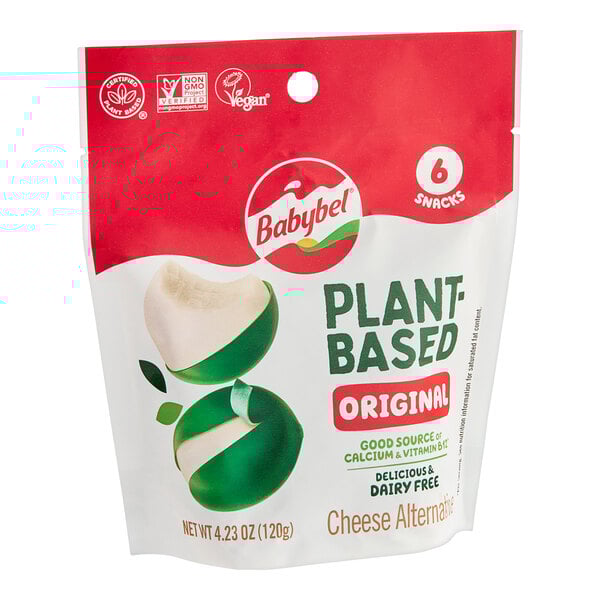 A white and green package of Babybel Plant-Based Cheese on a white background.