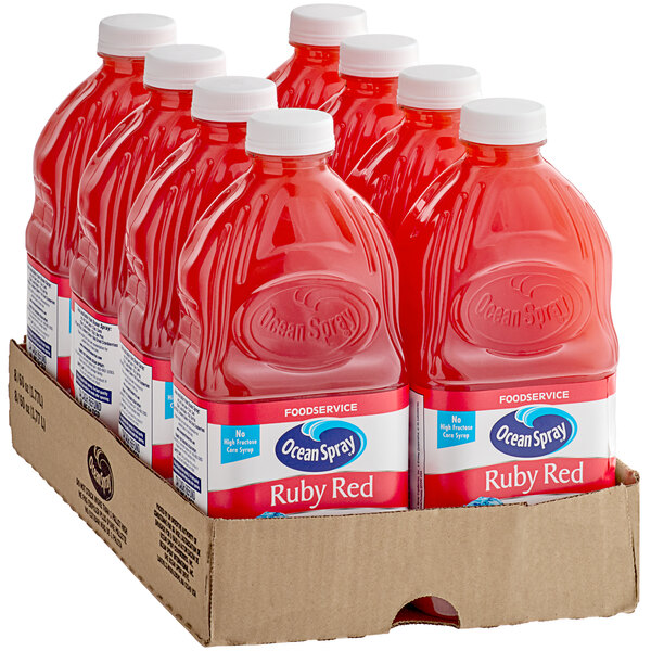 A box of six Ocean Spray Ruby Red plastic bottles of juice.