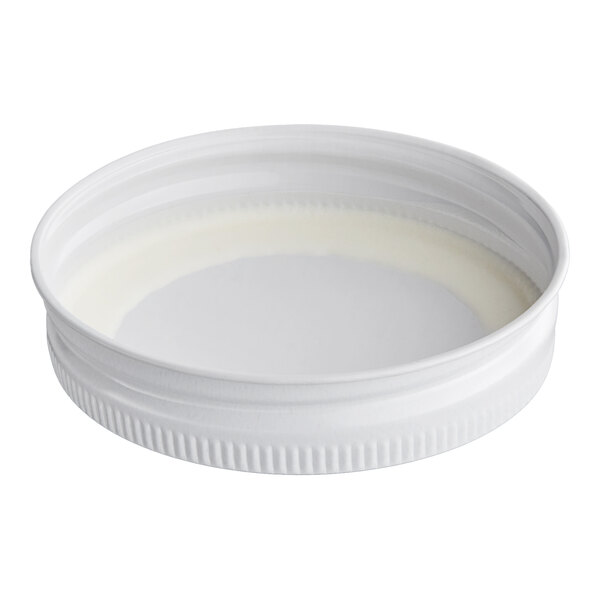 A white metal lid with a plastisol liner, sized 70/450.
