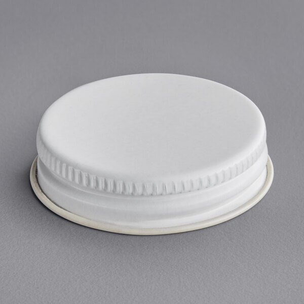 A white metal 38/400 lid with a white plastisol liner.