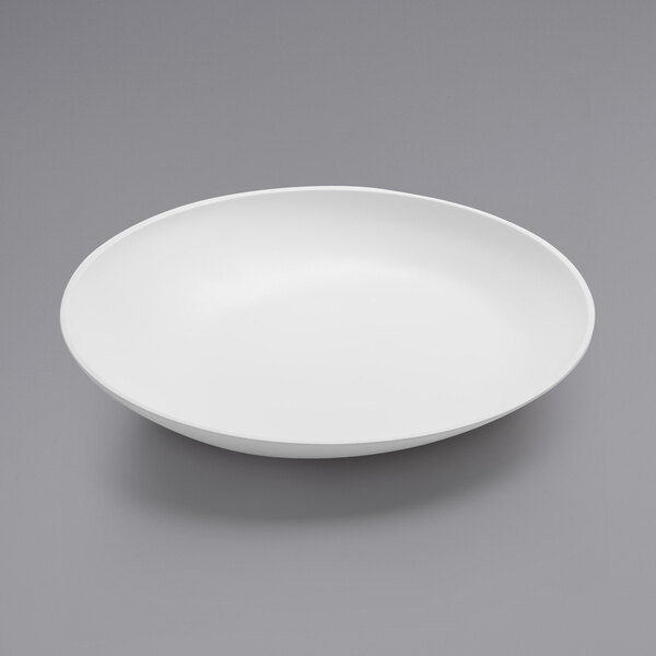 An American Metalcraft white melamine bowl on a gray surface.