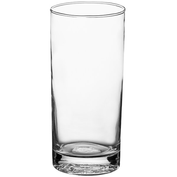 An Acopa Straight Up beverage glass with a clear liquid in it.