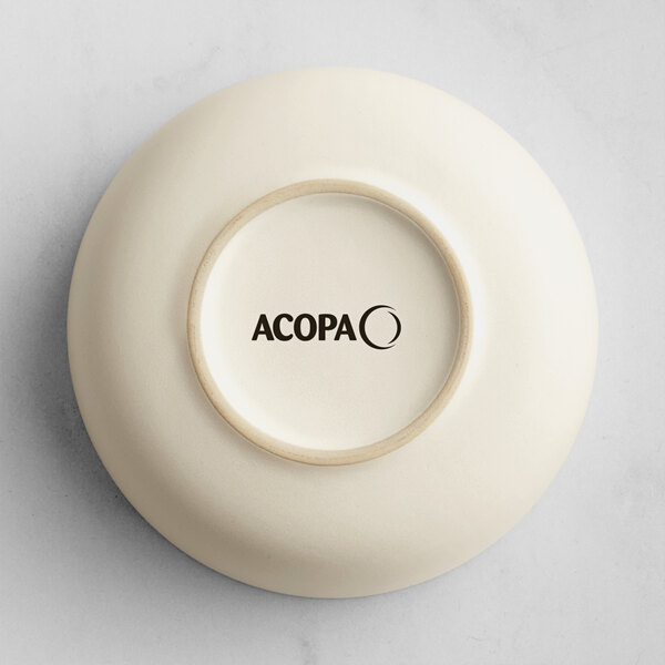 A white Acopa Pangea nappie bowl with black text on the rim.