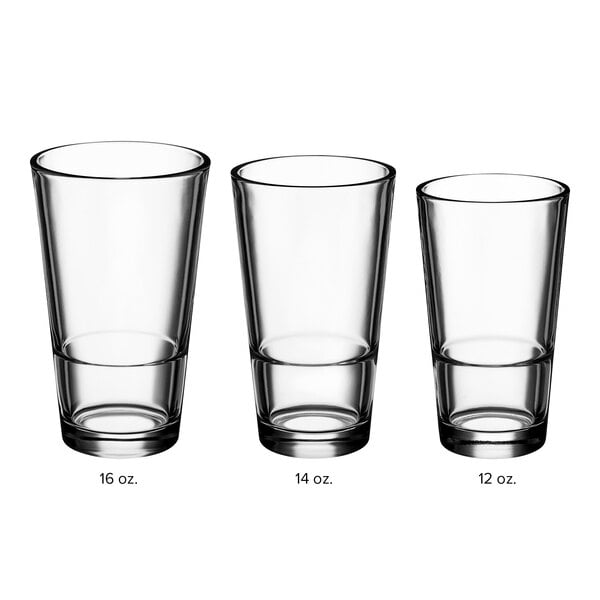 A row of empty Acopa Select stackable cooler/mixing glasses on a white background.
