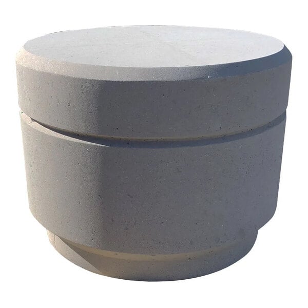 A round concrete bollard with a reveal line around its circumference.