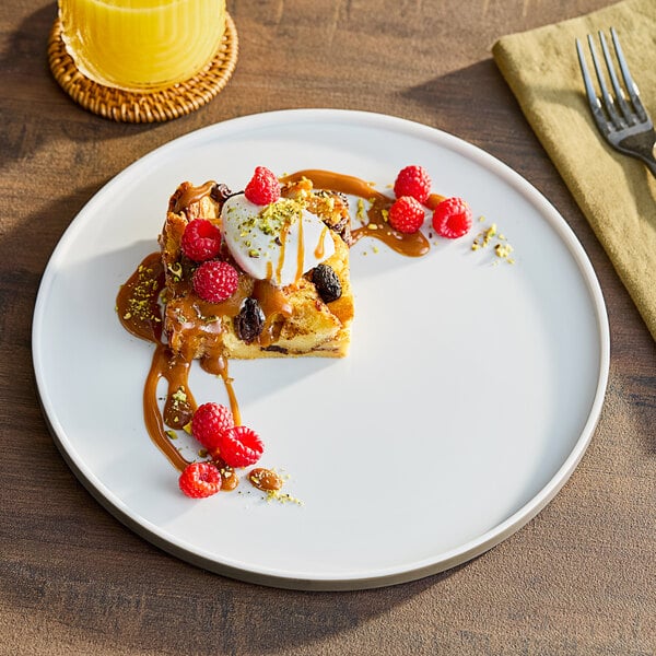An American Metalcraft Unity melamine mocha plate with dessert and berries on it.