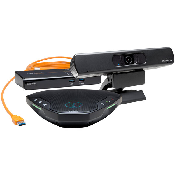 A close-up of a black Konftel video conferencing device with a cable attached.