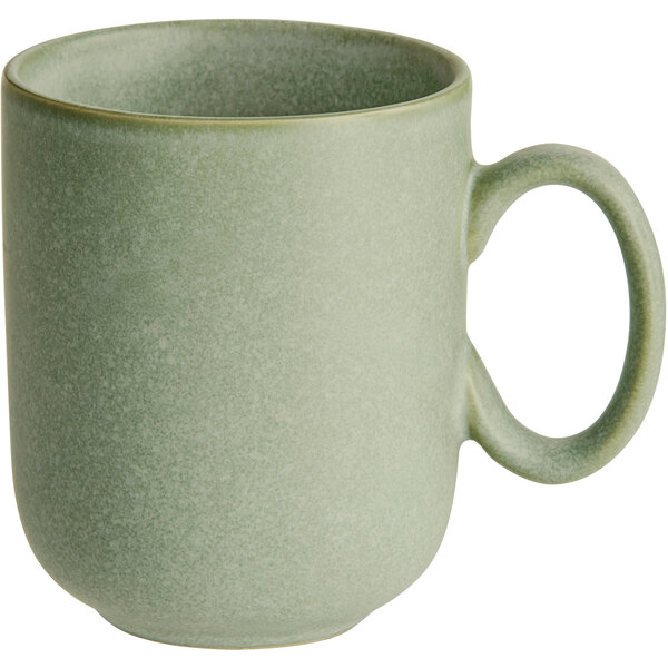 A close-up of an Acopa Pangea sage matte porcelain mug with a handle.
