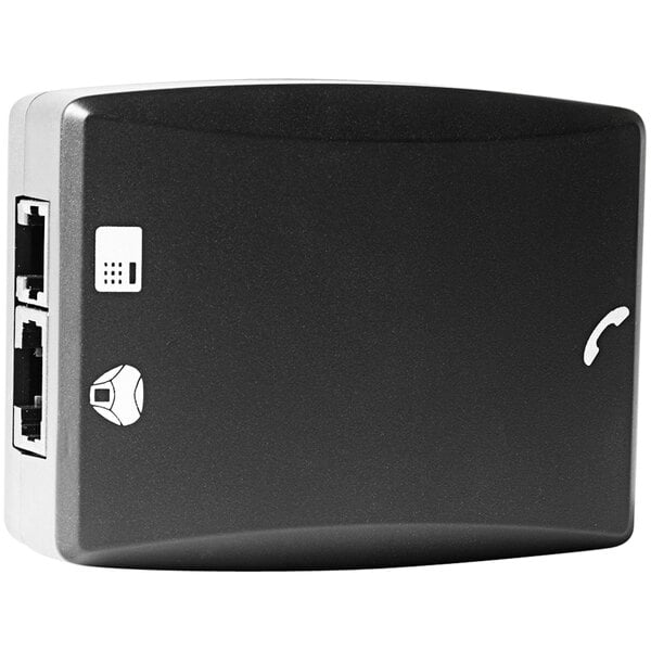 A black rectangular Konftel deskphone adapter with white buttons and ports.