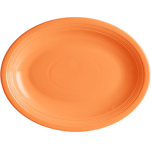An orange oval Acopa Capri stoneware platter.