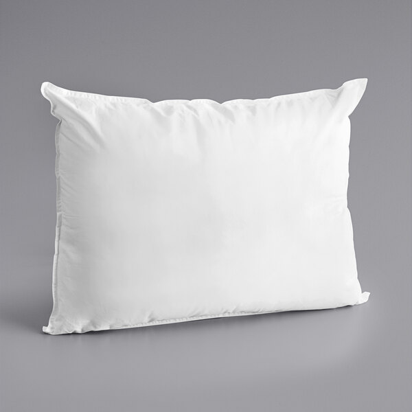 A white Oxford Diamond King Size microgel pillow on a gray surface.