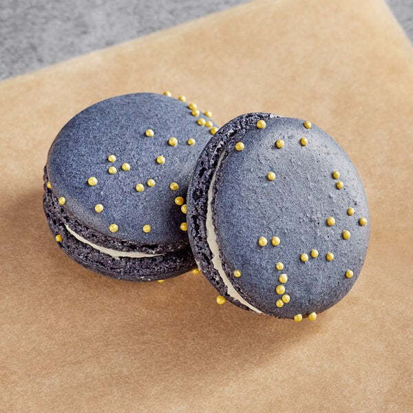 Two blue Macaron Centrale with yellow dots on top.