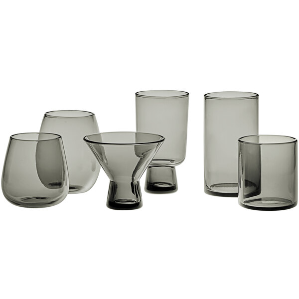 A group of Acopa Pangea gray stemless wine glasses on a table.