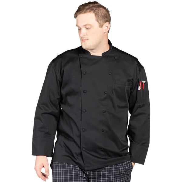 A man wearing a black Uncommon Chef long sleeve chef coat with mesh back.