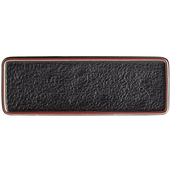 A black matte textured rectangular stoneware plate.