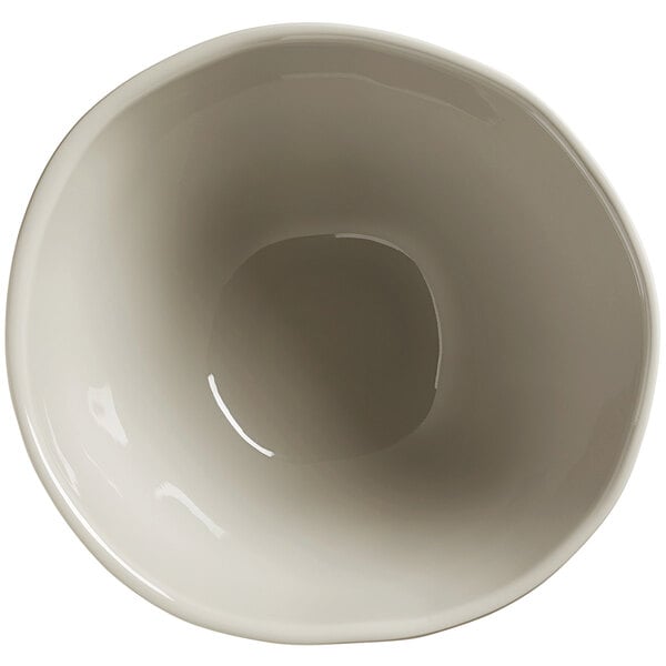 A white bowl with a small rim and a black circle with a white line on the inside.
