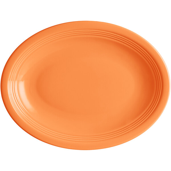 An orange oval Acopa Capri stoneware platter.