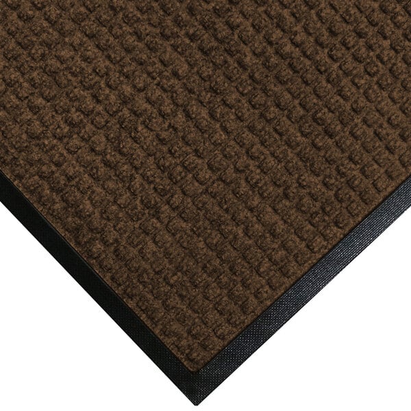 A dark brown WaterHog mat with classic black rubber border.