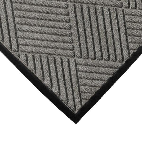 A close up of a grey WaterHog mat with black lines forming a diamond pattern.