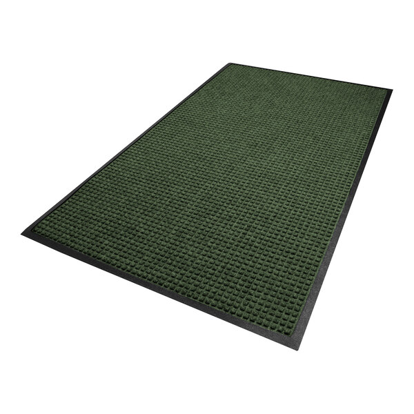 A rectangular green mat with a textured surface and a black rubber border.