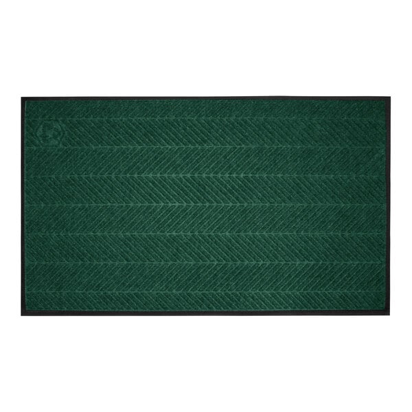 A rectangular green mat with a subtle diagonal stripe pattern and a black border.