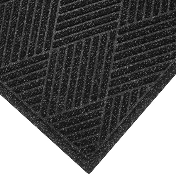 A close up of a black WaterHog Eco Premier doormat with a square pattern and a fabric border.