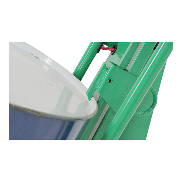 A green and white Valley Craft steel drum truck with a metal drum on it.