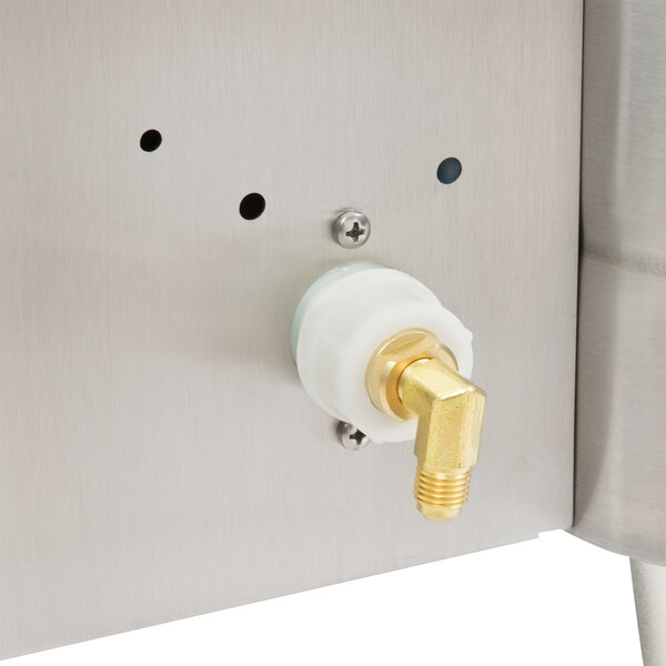 A stainless steel Cecilware automatic coffee urn with gold nozzles.