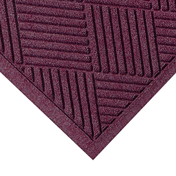 A WaterHog Diamond Fashion bordeaux mat with a square patterned border.