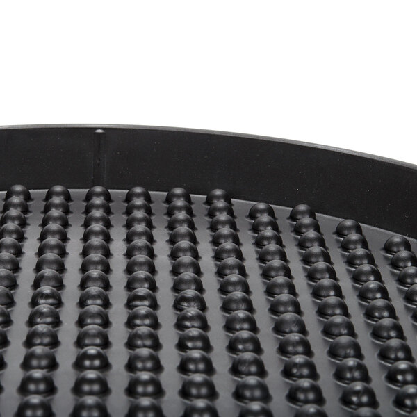 A black polypropylene pizza tray with small round holes.