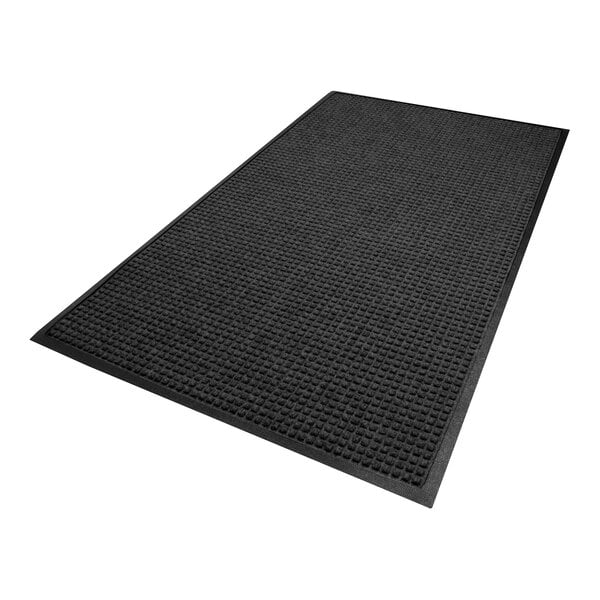 A rectangular black mat with a textured, grid-like surface and a smooth border.