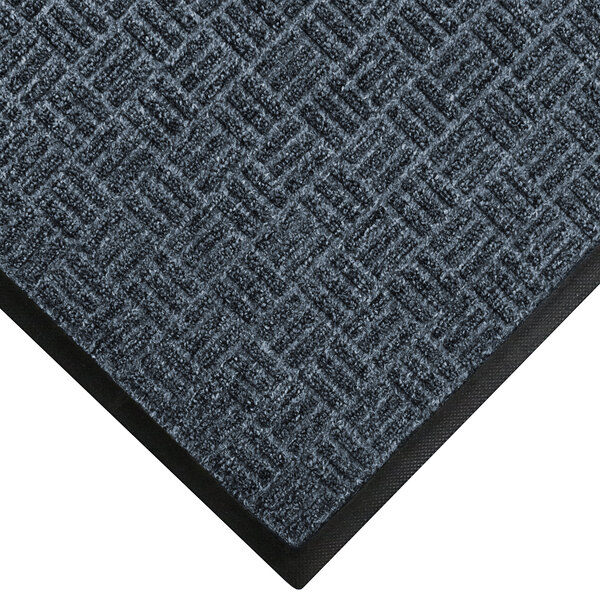 A close-up of a black and gray WaterHog carpet mat with a black border.