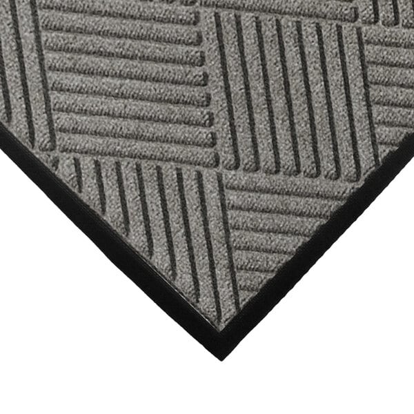 A close-up of a grey WaterHog Classic mat with black lines in a diamond pattern.