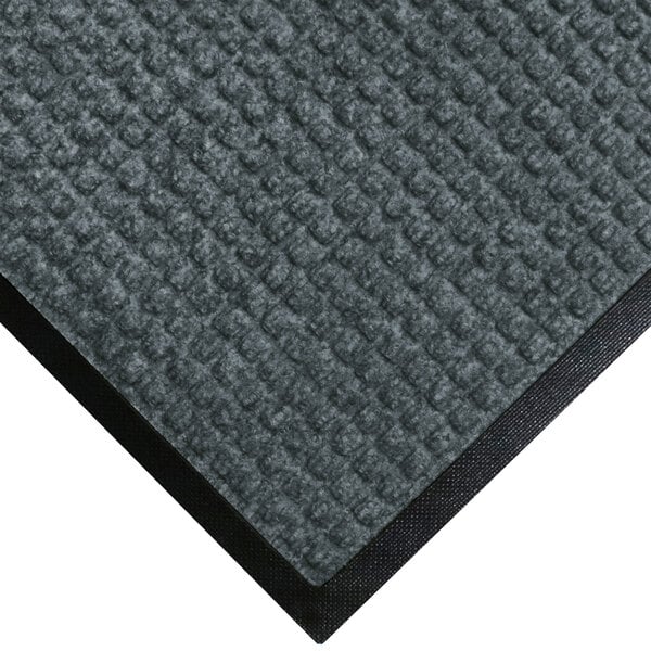 A gray WaterHog carpet mat with black rubber border.