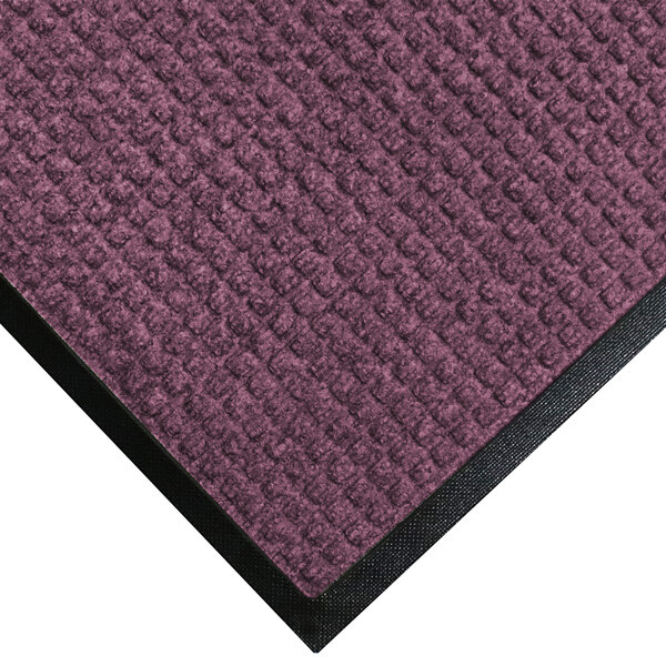 A M+A Matting WaterHog Bordeaux mat with black rubber border.
